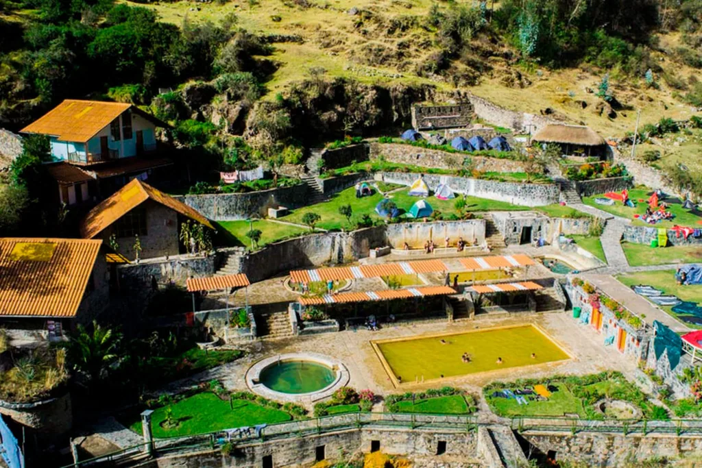 Aerial view of the Lares hot springs complex with terraced lawns, pools and traditional roofs